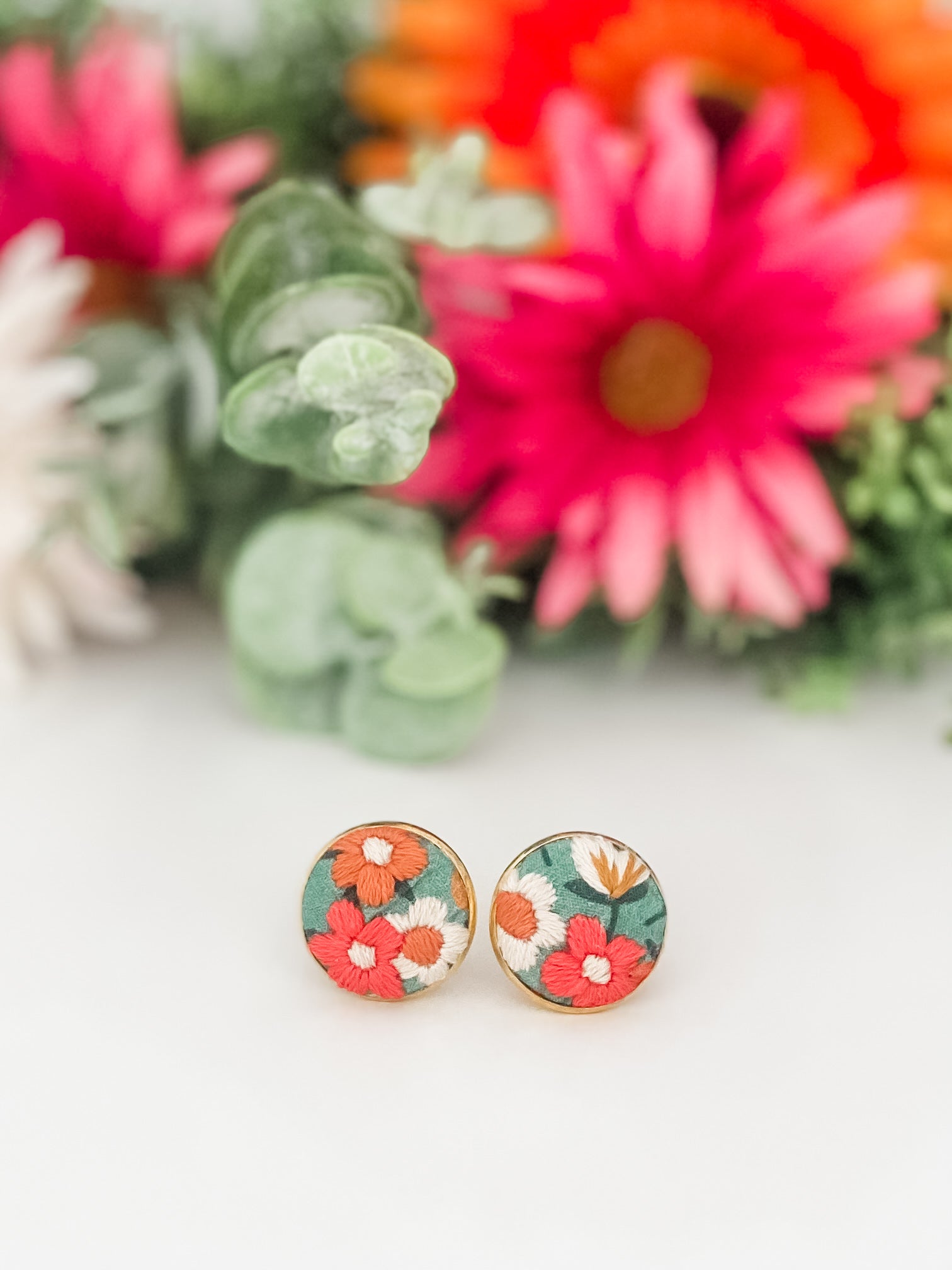 Round clip-on earrings, hand-embroidered